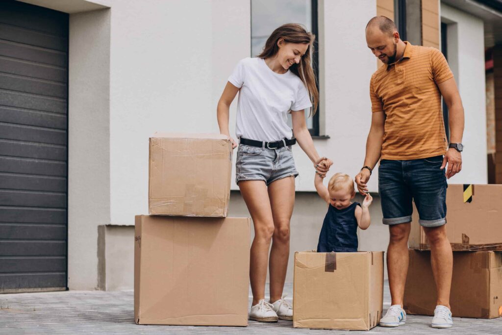 happy couple moving in after they bought a house with programul prima casă